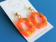 Load image into Gallery viewer, Random Resin - Neon Orange and Gold Glitter Dangle with gold ball top
